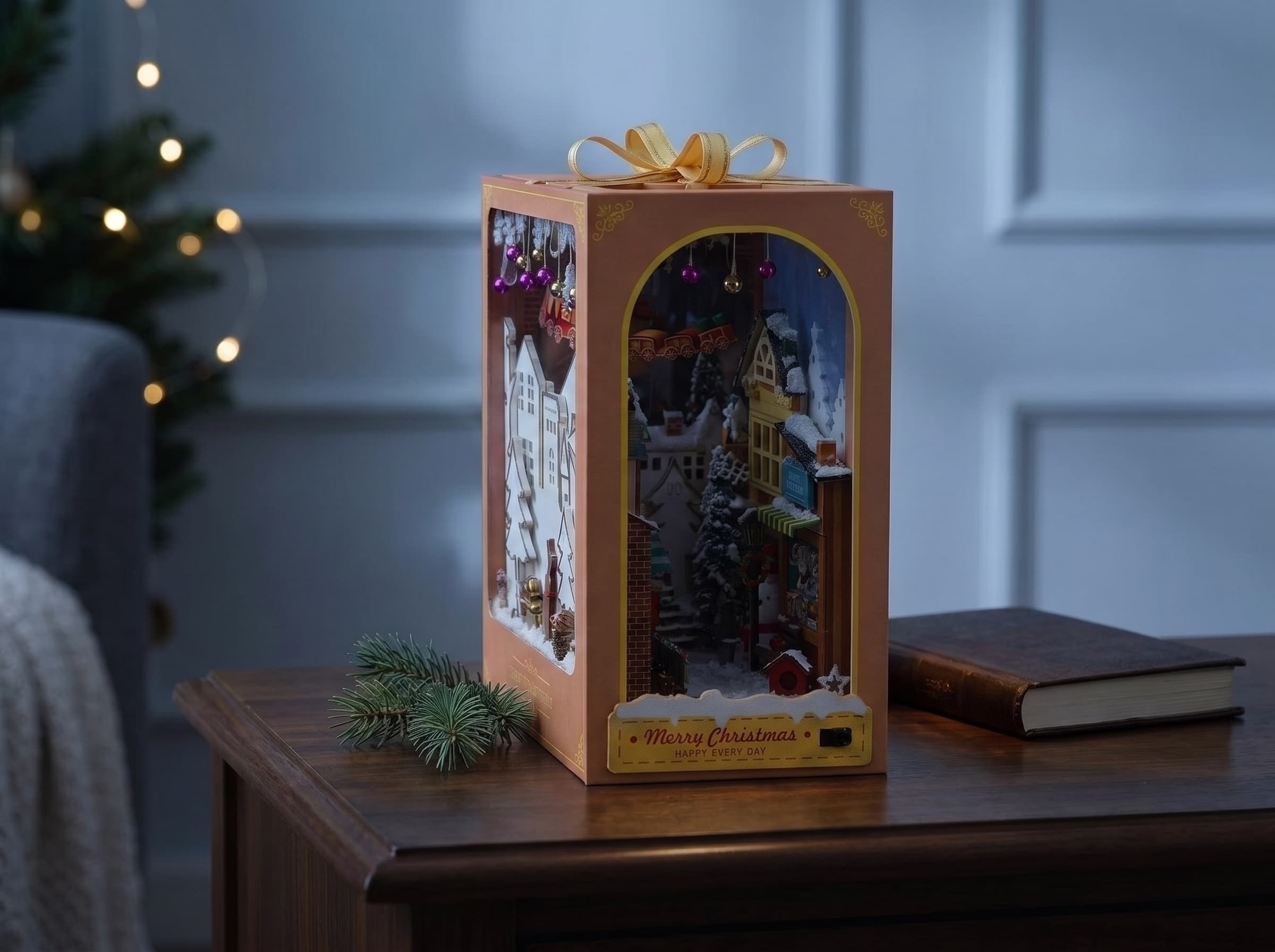 The Christmas Village book nook on a side table, light off